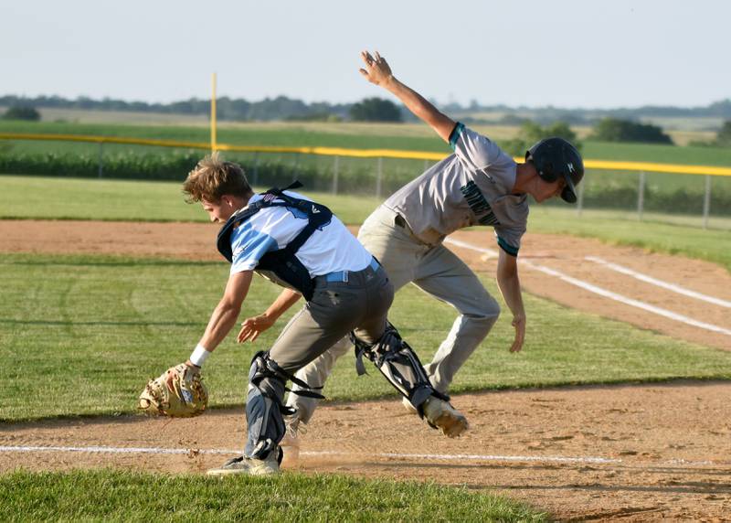 Southwest Valley runner Ethan Bruce collides with East Union catcher Logan Findley as he heads for home plate and Findley goes for the ball. The Timberwolves won the physical matchup in a 10-1 upset.