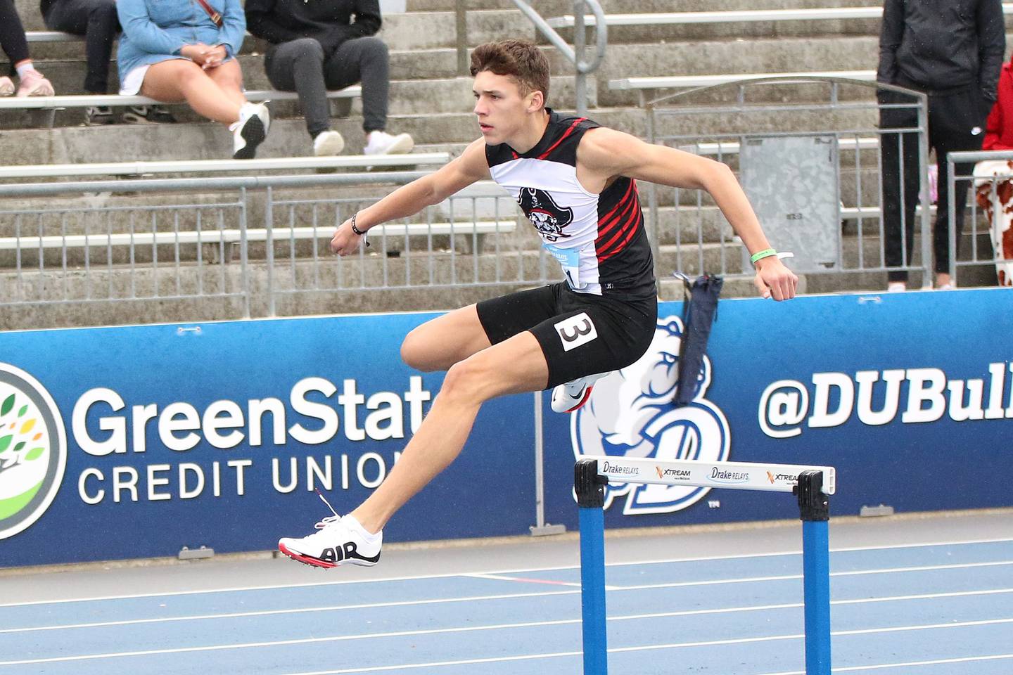 Reynolds clears a hurdle at the 2023 Drake Relays