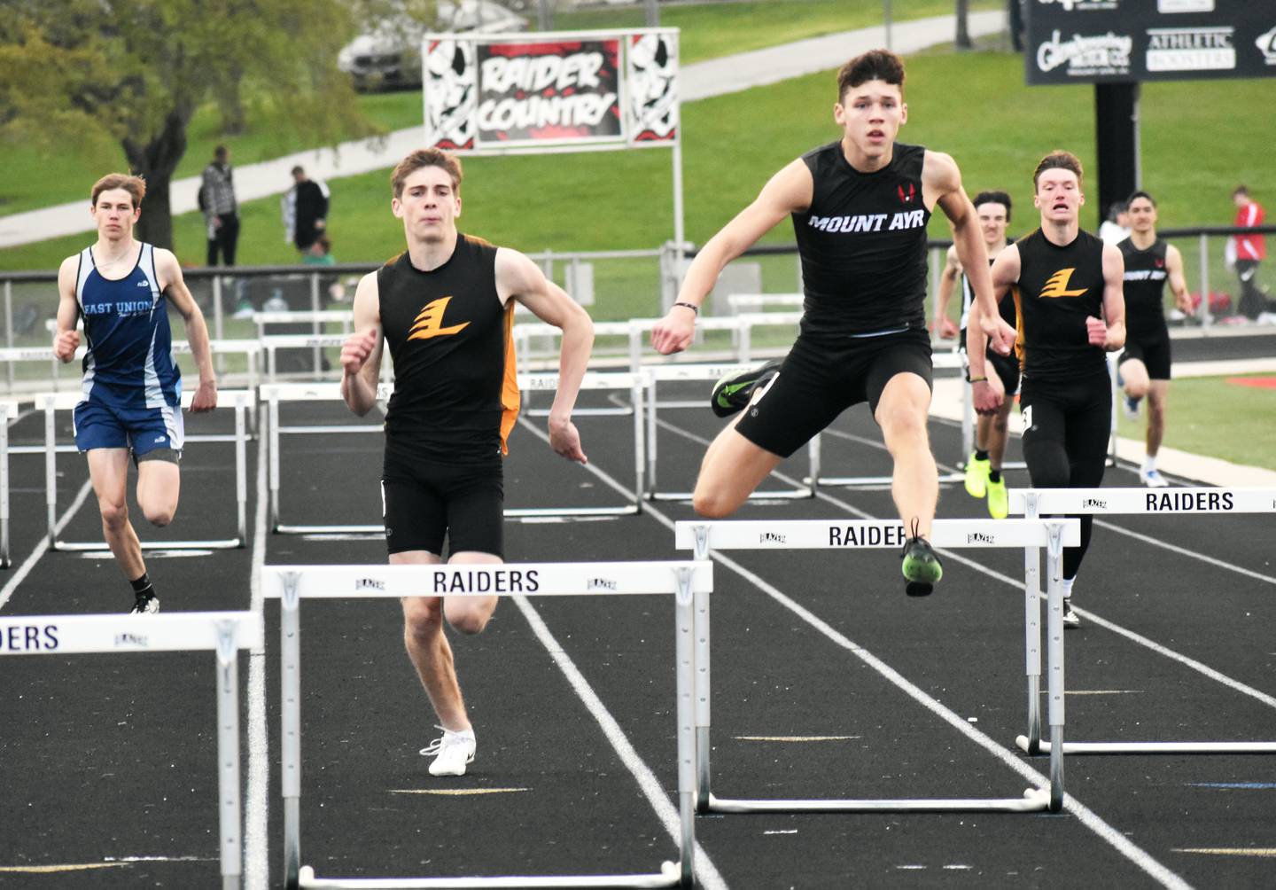 Gabe Funk of Lenox and Reynolds compete in a 400m hurdles race.