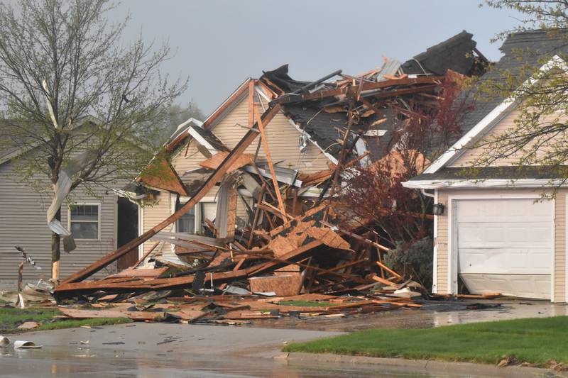 A house on West Prairie Street was damaged by a fallen beam from Homestead.