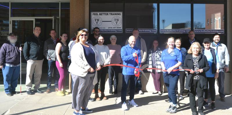 Members of the Creston Chamber of Commerce join Chris Doster for the ribbon cutting of his new personal training business Feel Better Training, found at 124 N. Maple St.