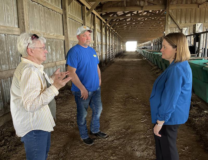 Iowa Attorney General Brenna Bird, right, meets with Ross Havens, center, and Lillian Nichols Monday during her tour of Nichols Farms.