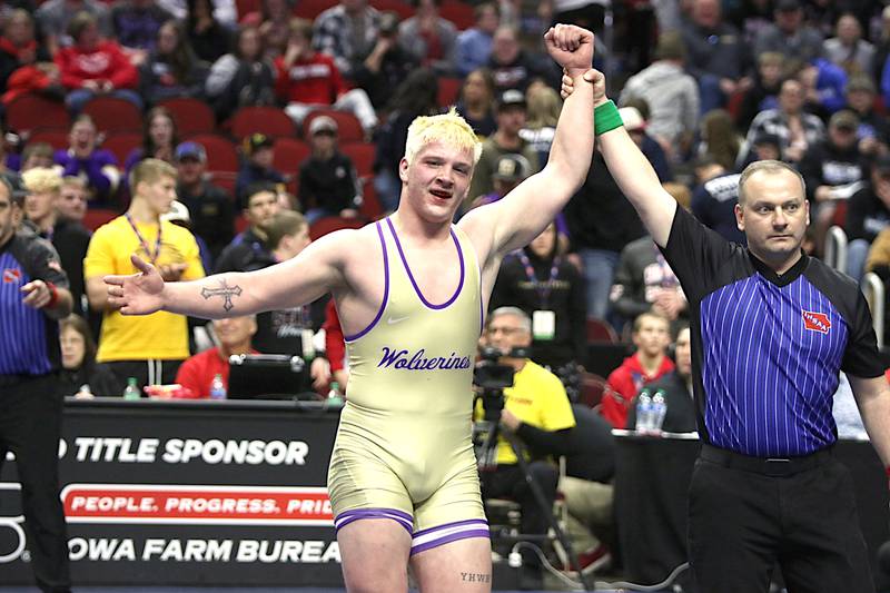Nodaway Valley/OM sophomore Ashton Honnold has his hand raised by the official after winning the state championship 8-6 in overtime Saturday, Feb. 17 at Wells Fargo Arena against Brady Davis of Maquoketa Valley.