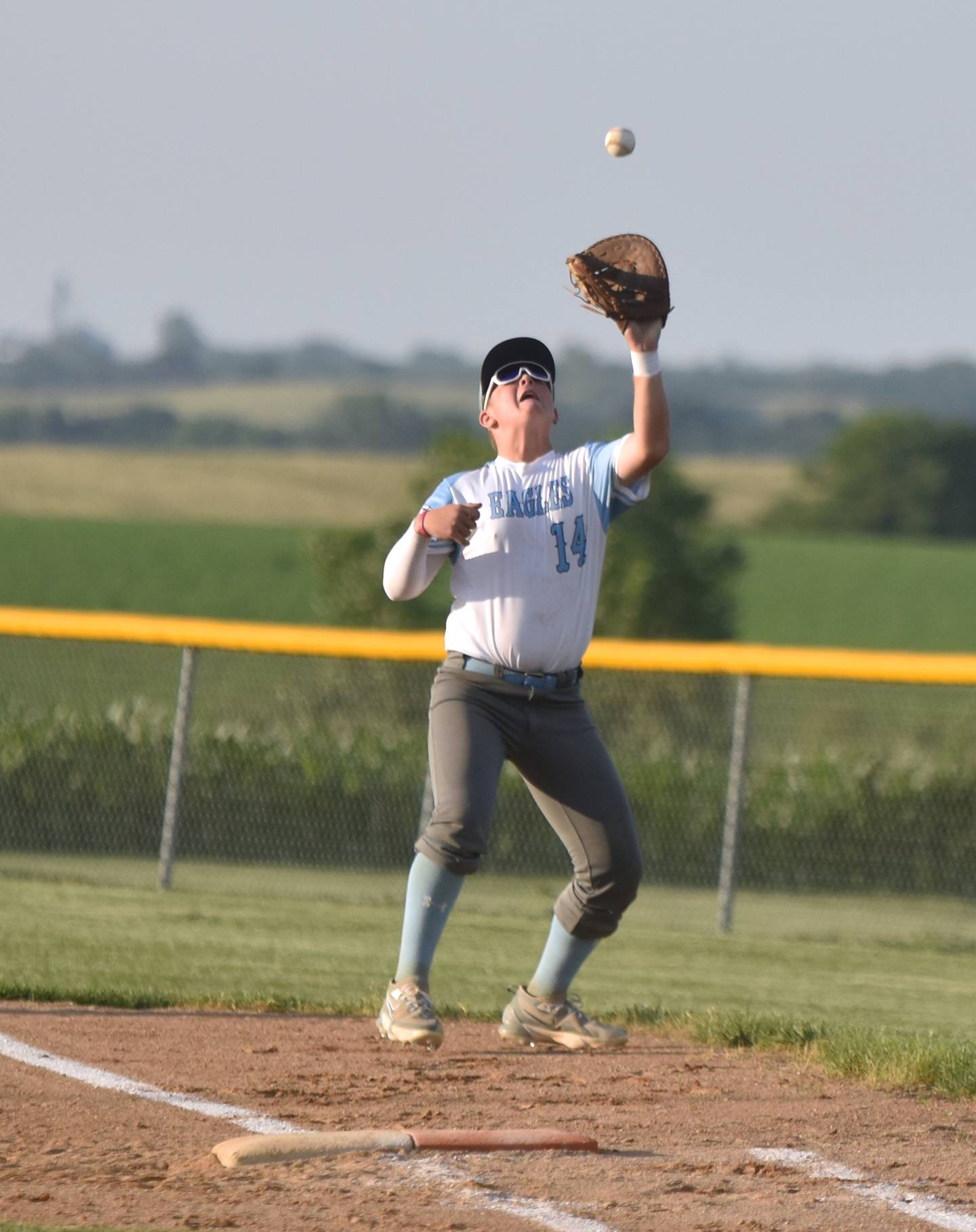 Eagles first baseman Braden Kelley catches a foul fly ball for an out.