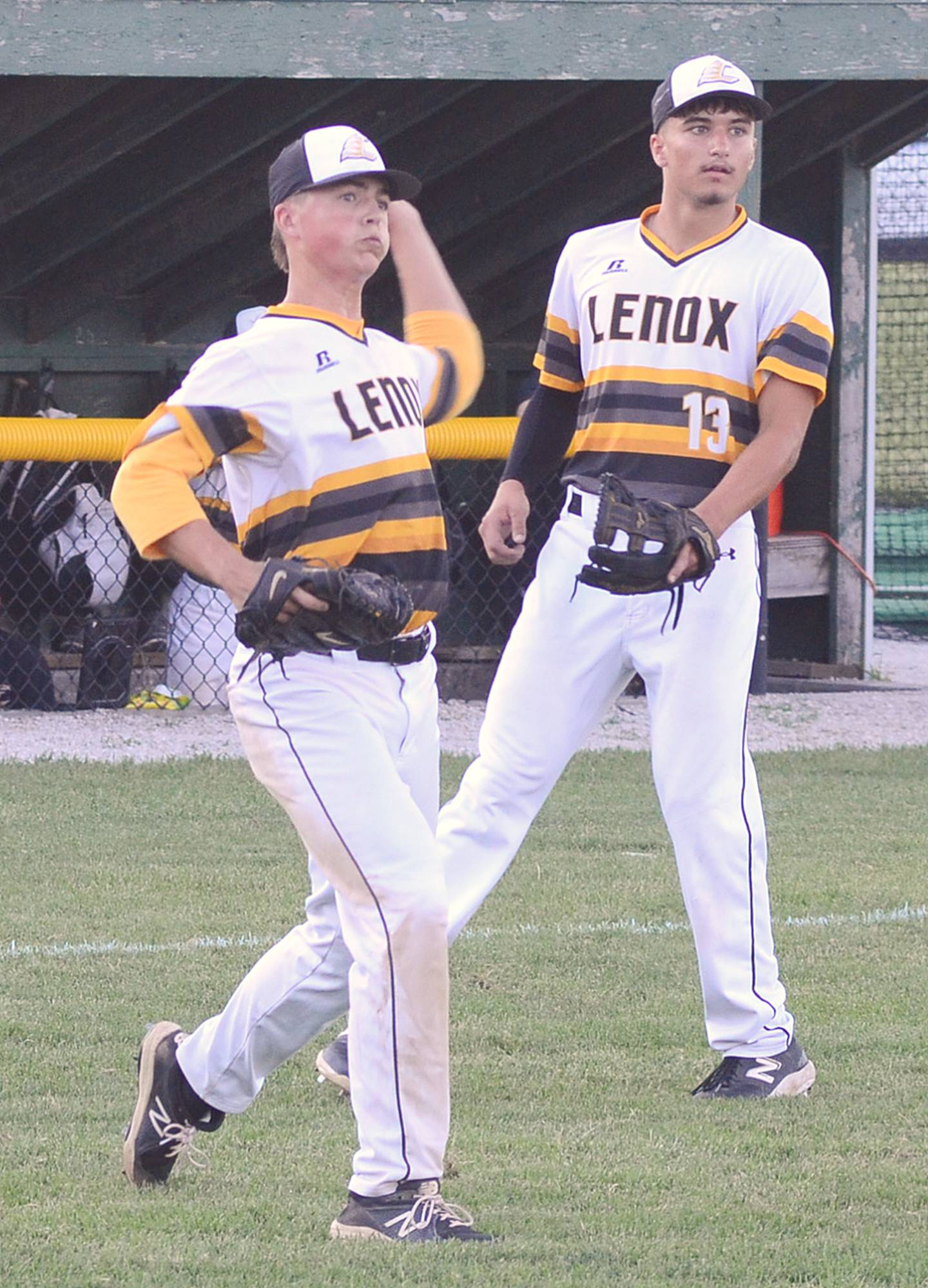 Lenox pitcher Laramie Stoaks throws to first base after fielding a sacrifice bunt as third baseman Brody Brokaw looks on during Tuesday's district tournament game against St. Albert. Stoaks pitched six shutout innings in the 4-0 victory.