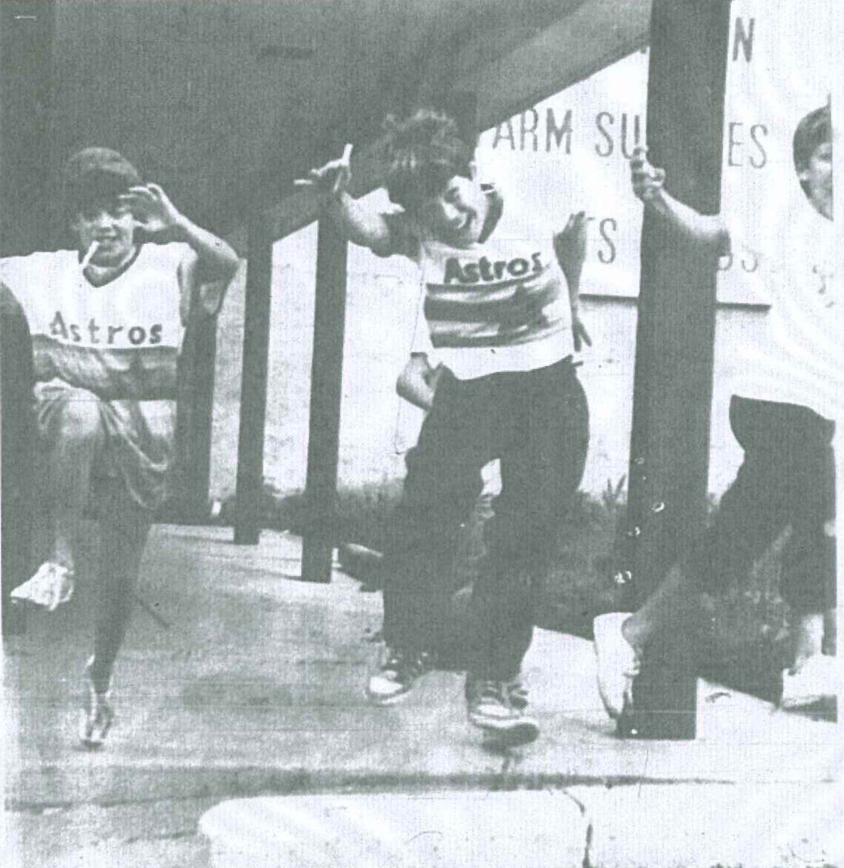 A group of boys passes time Wednesday waiting for one of their mothers to pick them up downtown. Jumping over the parking stopper are, from left, Jordy Reha, Scott Coen, Pat Coen and, mostly obscured behind Scott Coen, Eric Green.