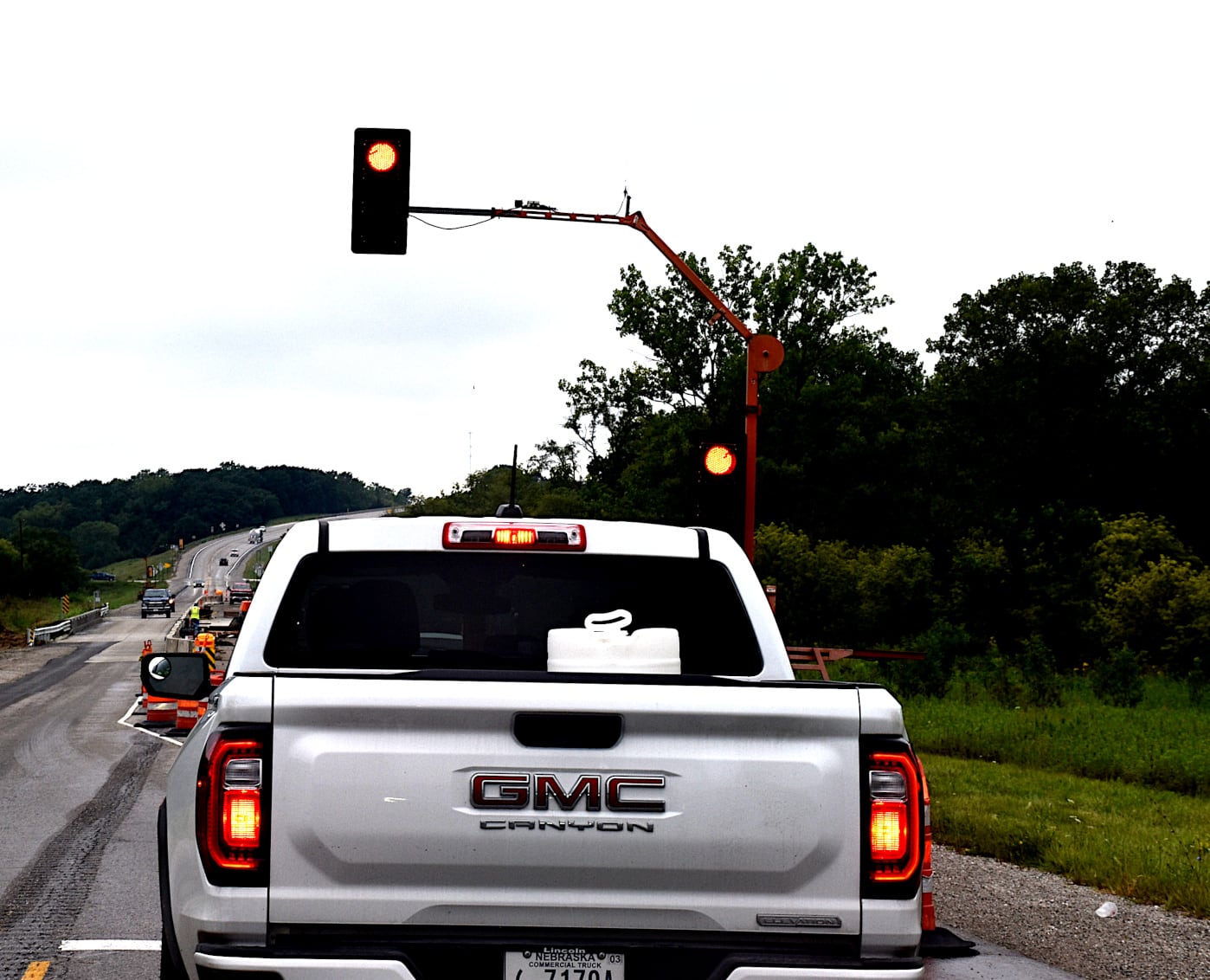 Traffic waits for the light to turn green on U.S. Highway 34 near Thayer. The light is used to control traffic for road work that creates one-lane of traffic. Union County is researching purchasing one.