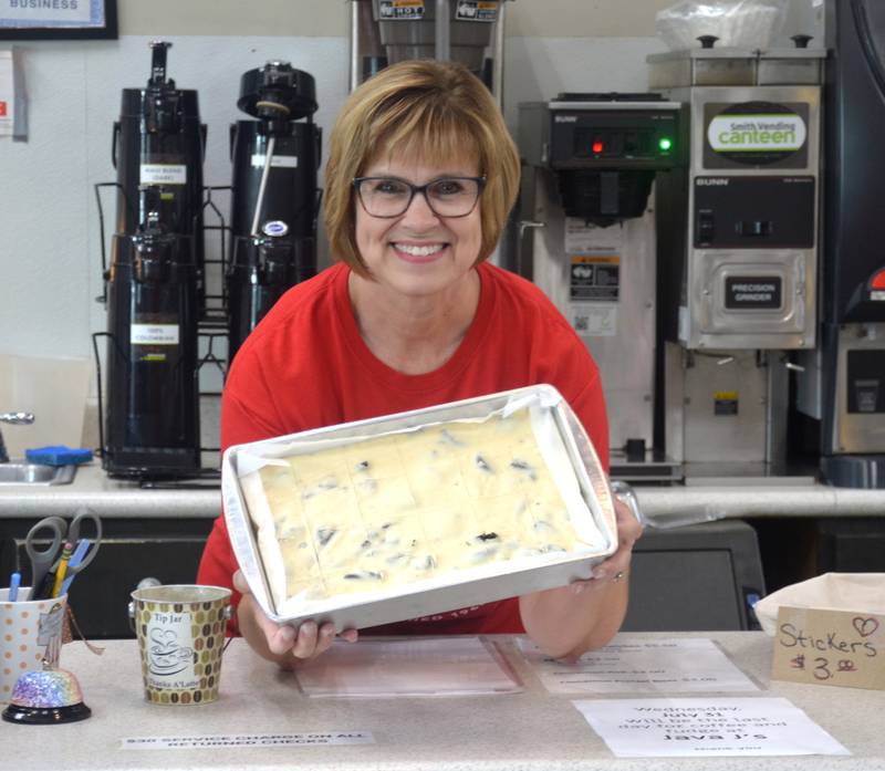 Java J's owner Juliann Sinn poses with some of her famous fudge. Sinn will be retiring following the close of the store.