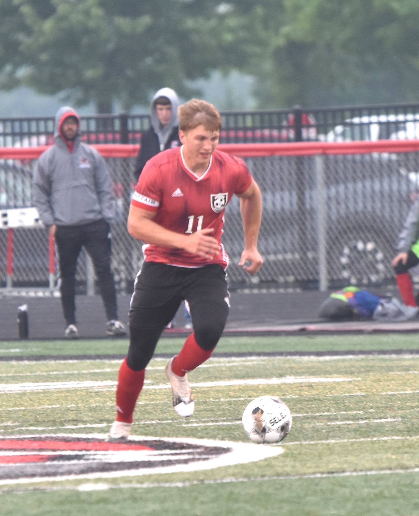 Senior Brennan Hayes dribbles the ball down field Monday at home against Red Oak in the first round of substate soccer. Hayes had both of the Panthers’ goals in the 2-0 win.