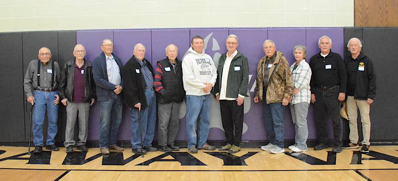 Wrestlers and those associated with wrestlers from the 1953-63 high school wrestling teams at an event Saturday night were from left, Mike McDermott (1953), Gerald Kirkland (1953), Gary Vorrath (1954), Darry Chiles (1955-56), Jay Howe (1956-58), Rory Benton for father Marion Benton (1954-57), Leo Herrick (1957-59), Ted Funke (1958-60), Laura Leander for father Denny Leander (1955-56), Ron Hager (1962-63) and John Gruss (1962-65). Next year begins Hall of Fame inductions for this event.