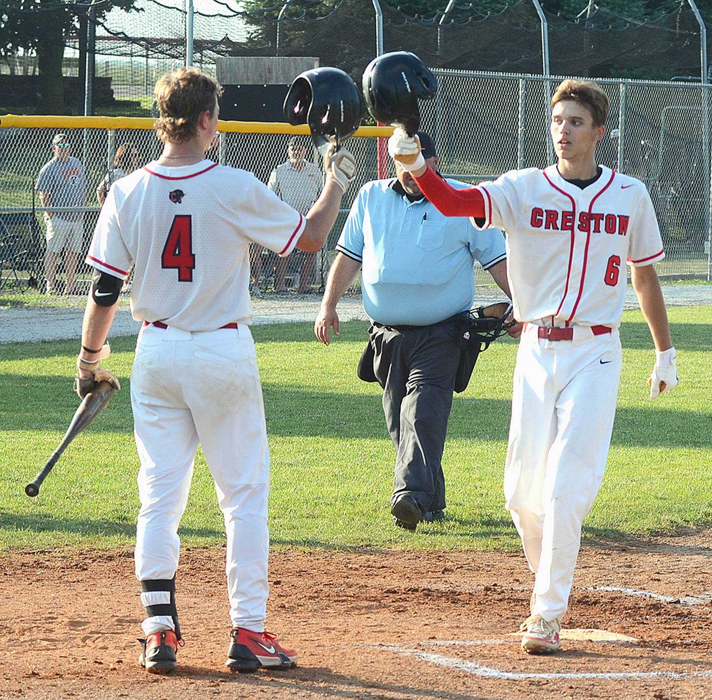 On-deck batter Cael Turner (4) congratulates teammate Dylan Hoepker (6) after Hoepker's solo home run tied the game at 1-1 in the third inning Thursday.