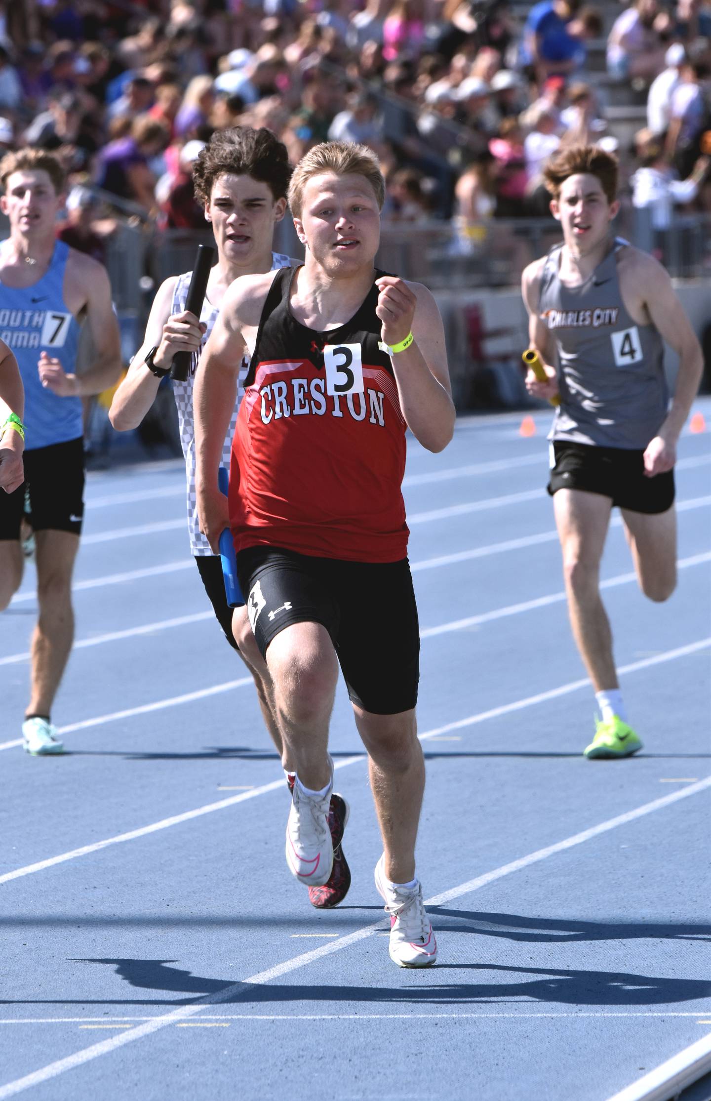Austin Evans runs at state track