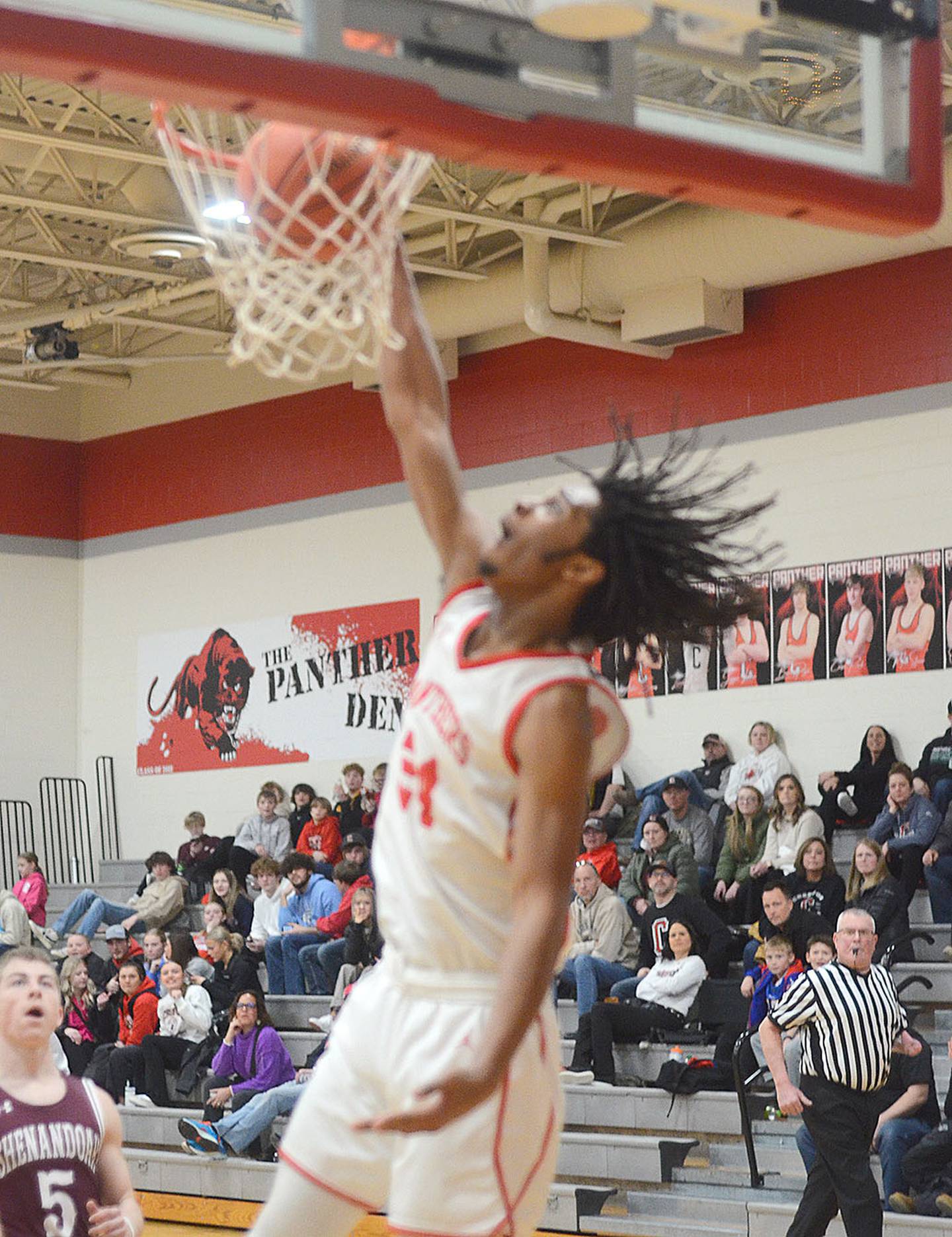 Creston senior Tony Davidson slams a breakaway dunk against Shenandoah Tuesday night. Davidson had nine points and seven rebounds in the Panther victory.