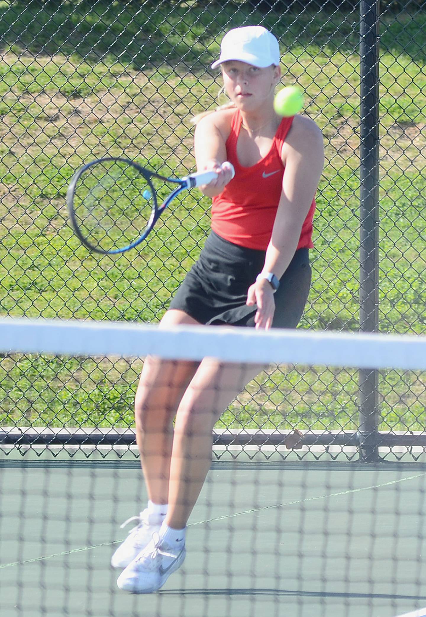 Creston senior Josie Mahan concentrates on a forehand shot during her singles match against Atlantic Friday. Mahan won 6-1, 6-4 at No. 1 singles.