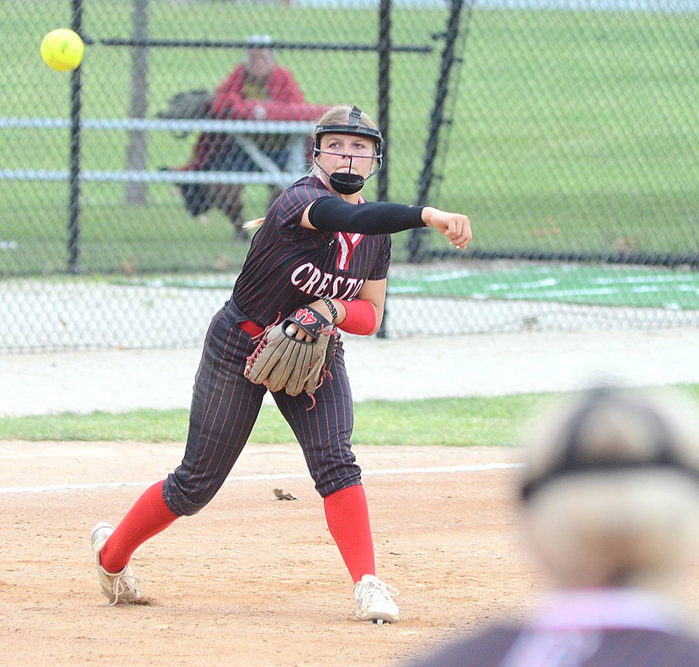 Creston third baseman Evy Marlin throws to first baseman Jaycee Hanson for an out during Saturday's loss to Dallas Center-Grimes. Marlin had two hits in the 6-5 win over Earlham later Saturday.