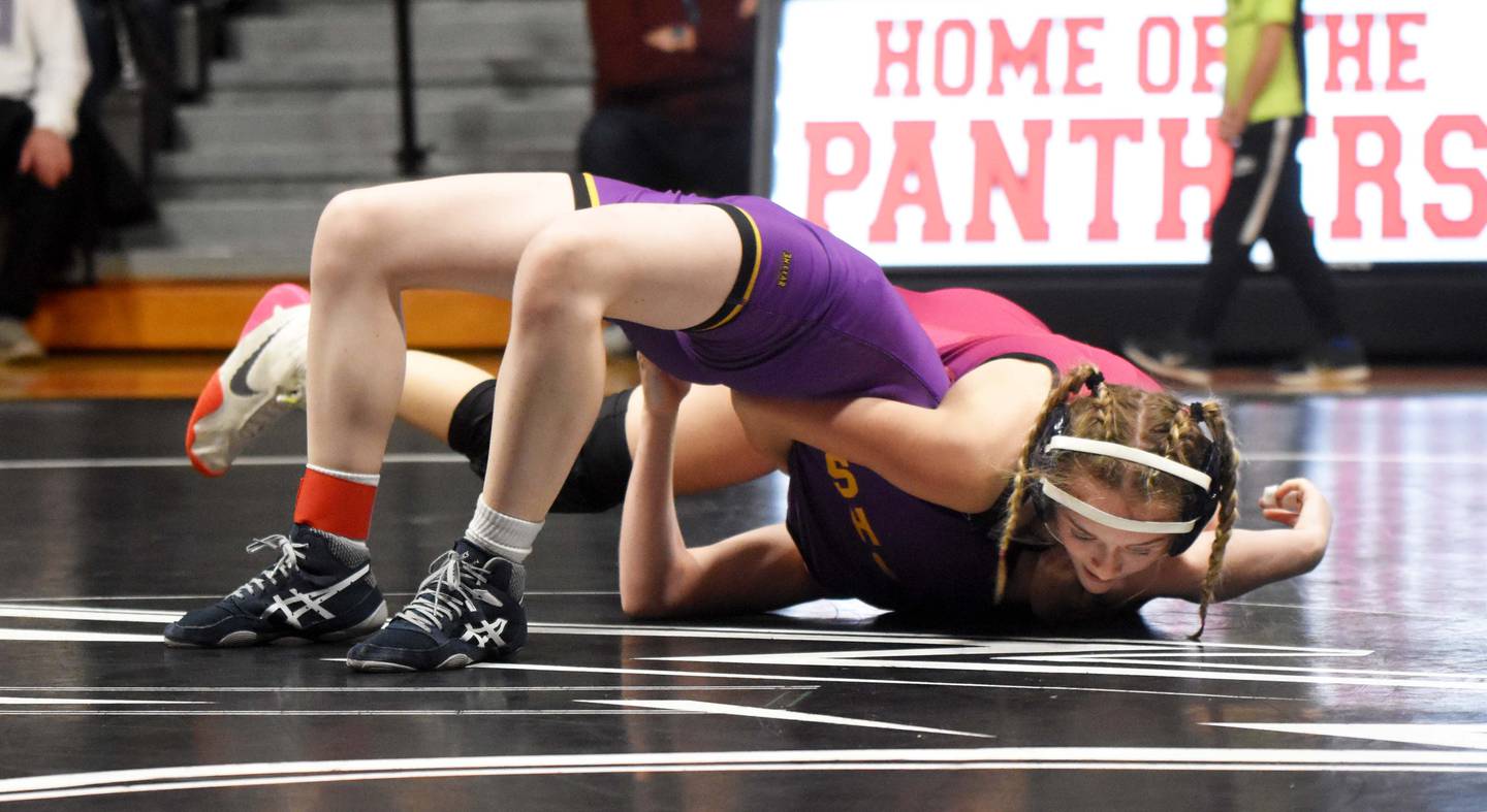 Quynn Foster works for a pin against Elaina Labertew. She pulled off the fall in 1:01 to get Highway 34’s first victory of the evening.