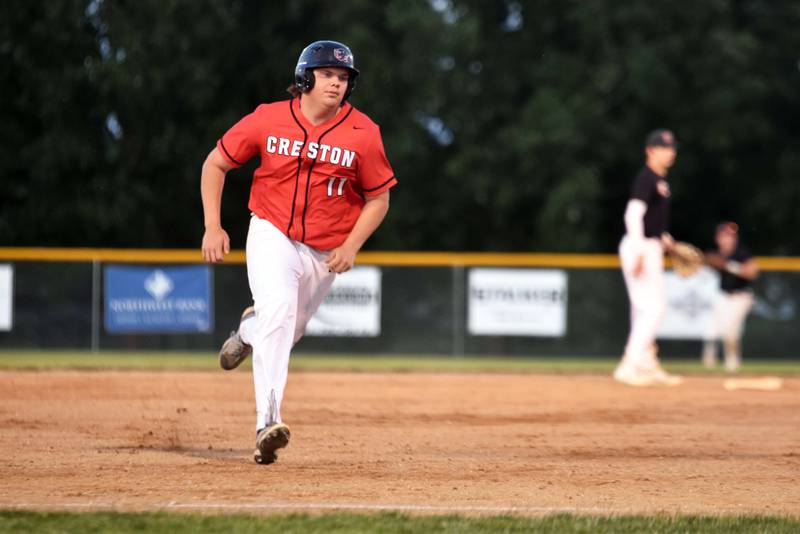Designated hitter Mattias Schultes rounds for third base in the second game Tuesday during a doubleheader with Harlan. The Panthers won the first game 2-1 but fell 12-1 in the next match.