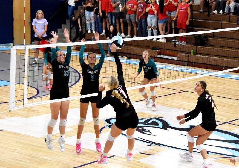 Southwest Valley’s Maddie Bevington (No.13) and Ray Helvie (No. 8) go up to defend an attack by Mount Ayr senior Jaxy Knight Tuesday in a Pride of Iowa triangular hosted by East Union. The Timberwolves won the matchup 2-1.