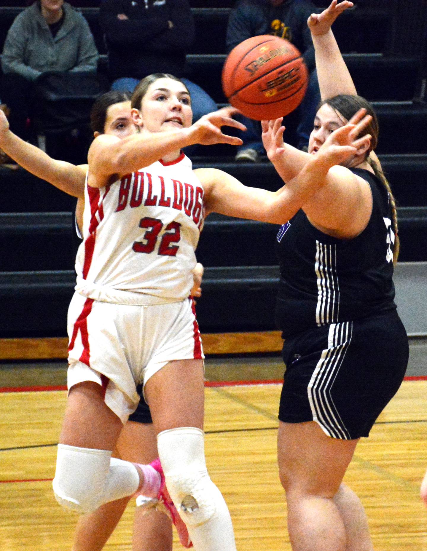 Orient-Macksburg's Emma Boswell passes out of traffic against Murray Thursday, Feb. 8 in the opening round of the playoffs.