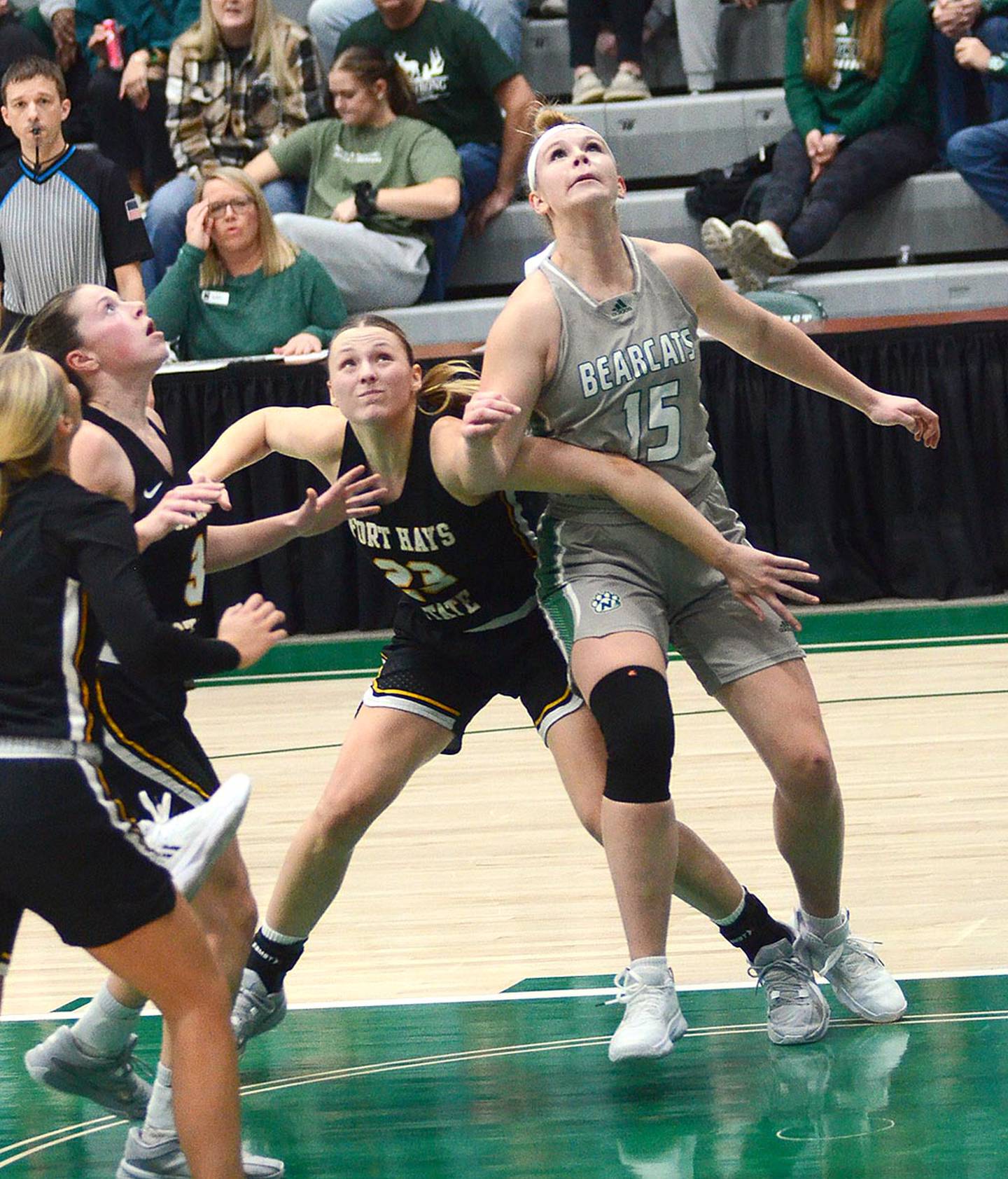 Creston's all-time leading scorer and rebounder, Kelsey Fields (15) battles for rebound position during a Northwest Missouri State home victory over Fort Hays State in February. Fort Hays State later defeated the Bearcats in both the semifinals of the MIAA tournament and the first round of the NCAA Division II national tournament.