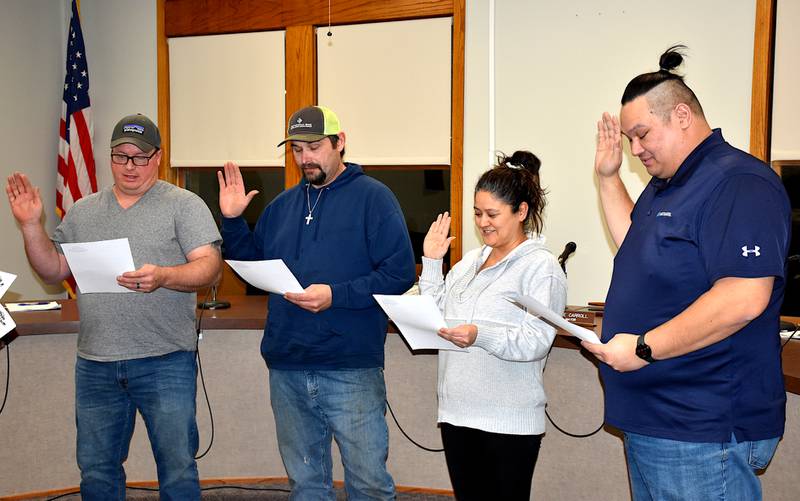 Council member Martin Graham, Mayor Waylon Clayton, and members Kiki Scarberry and Josh Thompson are sworn in as council members starting next month. Thompson had the only seat uncontested in the November election. The ceremony was part of Tuesday's meeting.