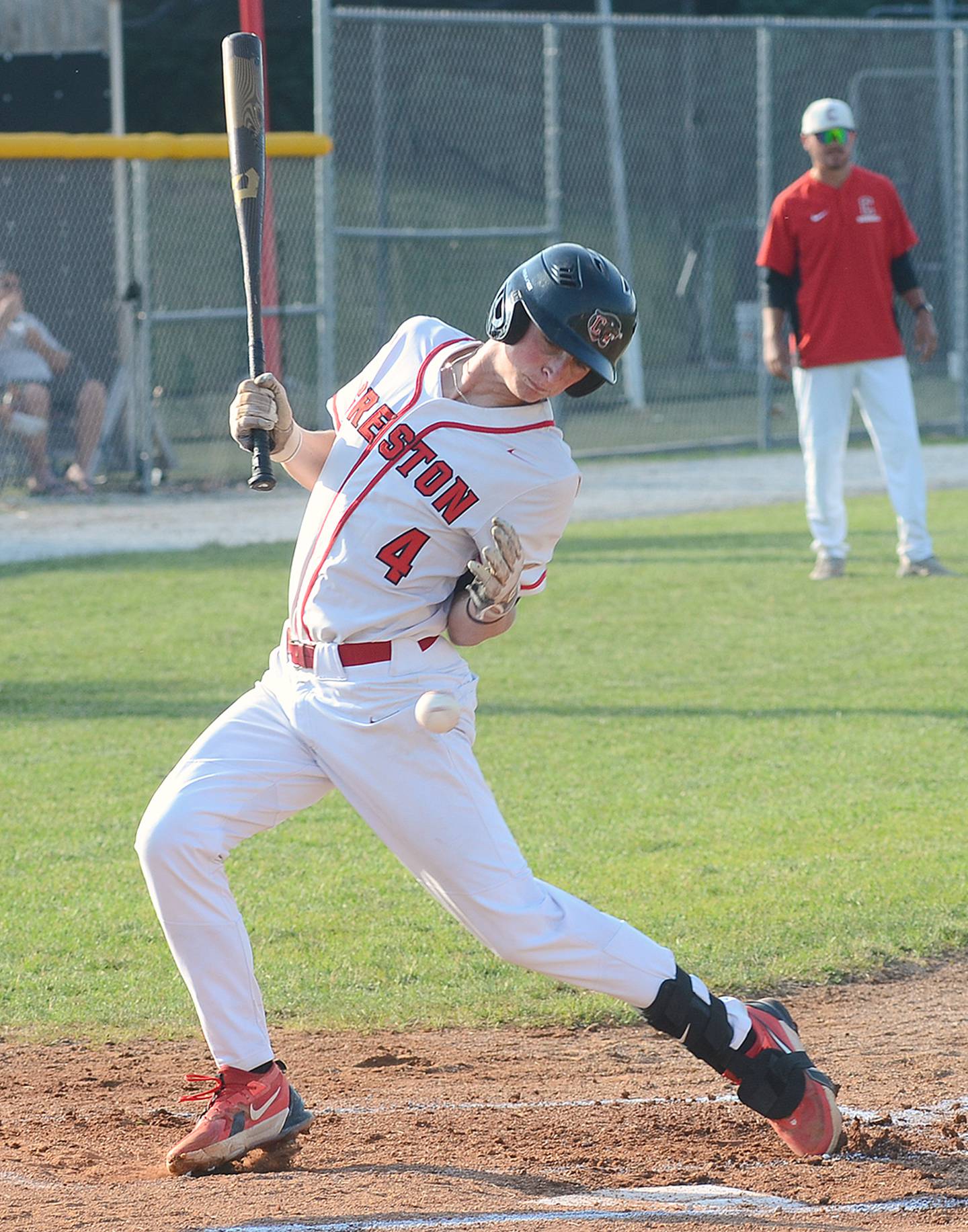Creston's Cael Turner is hit by a pitch in the first inning against Clarinda on Thursday.