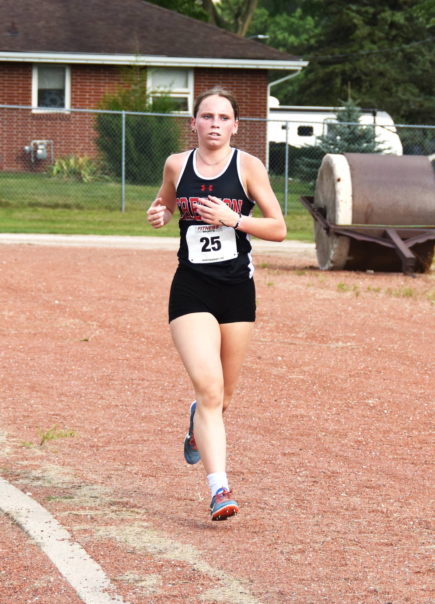 Senior Karter Clayton runs the final stretch of the race on the track. She finished third for the Panthers with a PR of 24:08.7, good for 14th place. The girls took second to I-35.