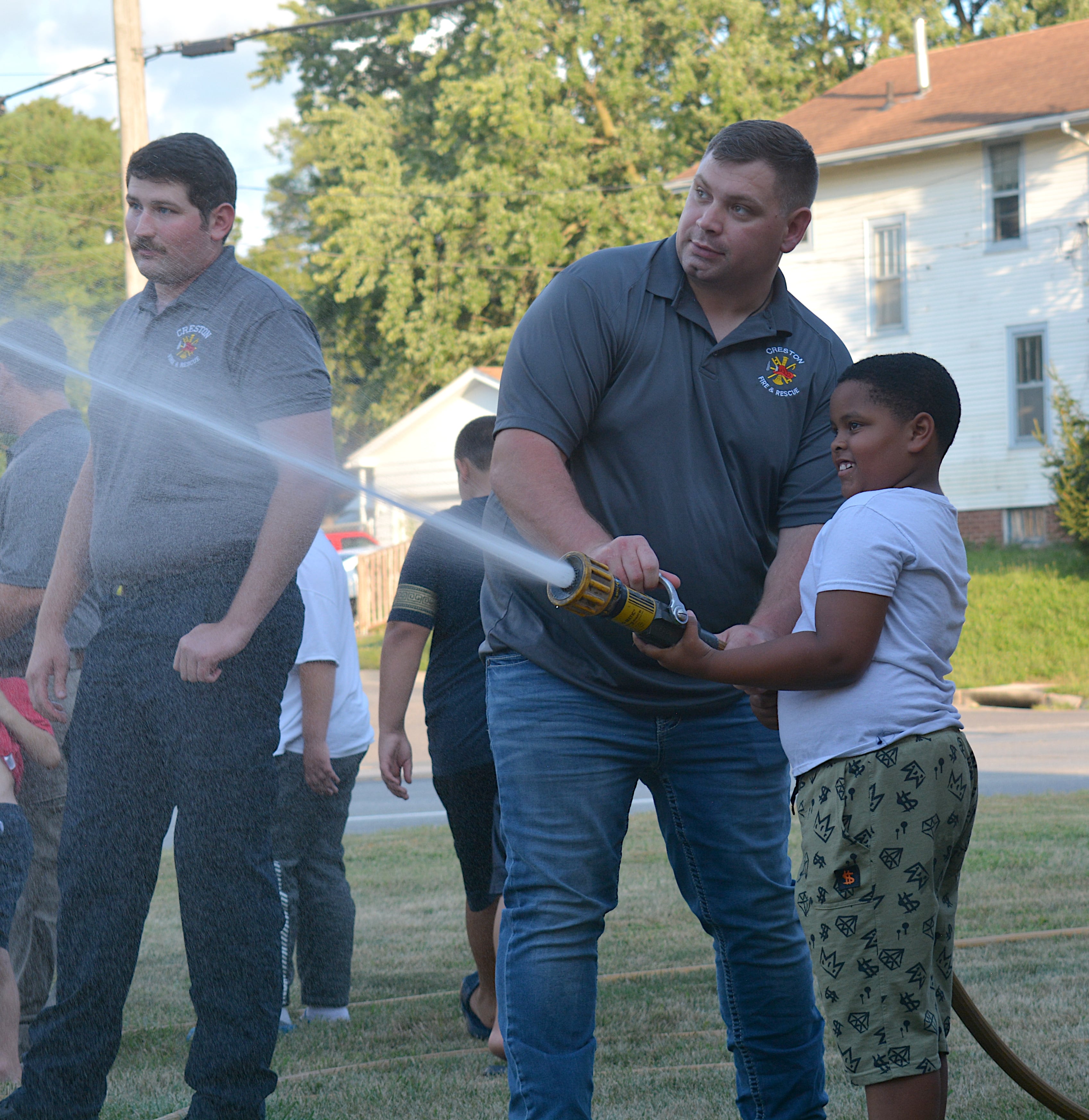 Hoses were brought out for the community to give the new tanker its first wash in the Creston station.