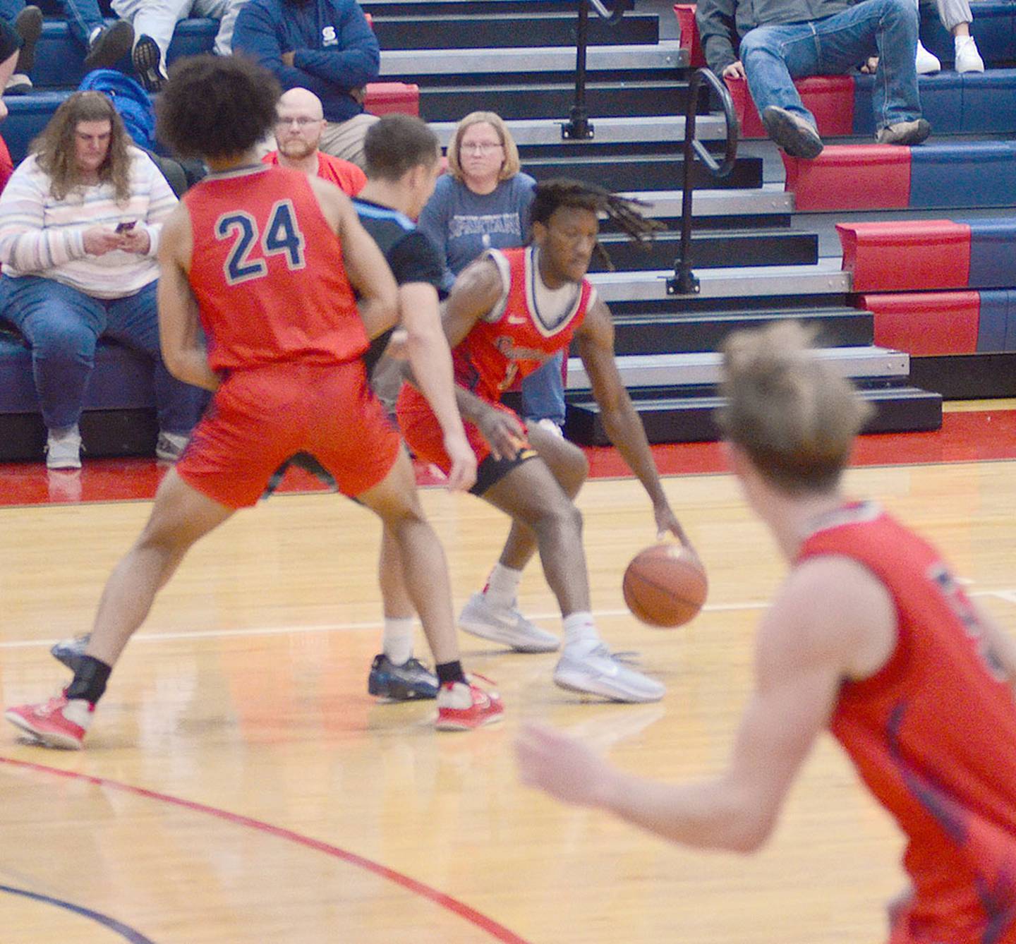 Southwestern point guard Justin Bussey drives around a screen by teammate Andrew Scoggins during Wednesday's game. Bussey had eight points in the season opener.