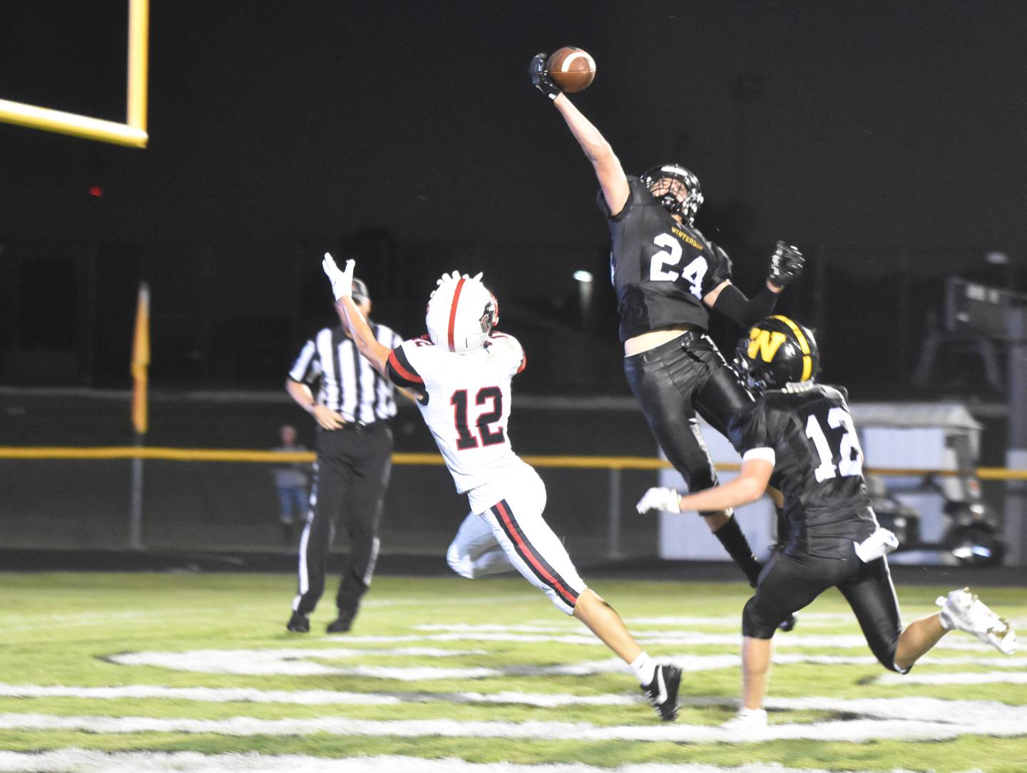 Winterset's Jace Bellamy gets a hand on a Creston pass, bringing in the end zone interception.