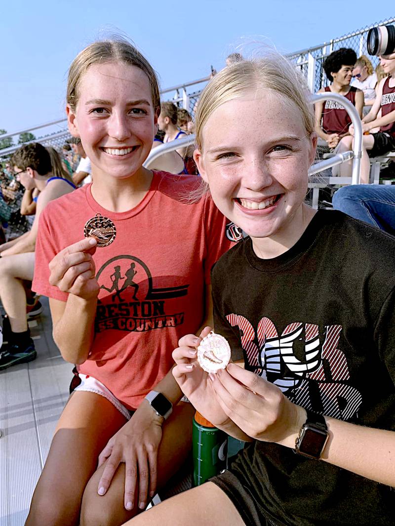 Payton Davis, left, and Reese Strunk show their medals after their top 10 finishes Tuesday at Maryville, Missouri.