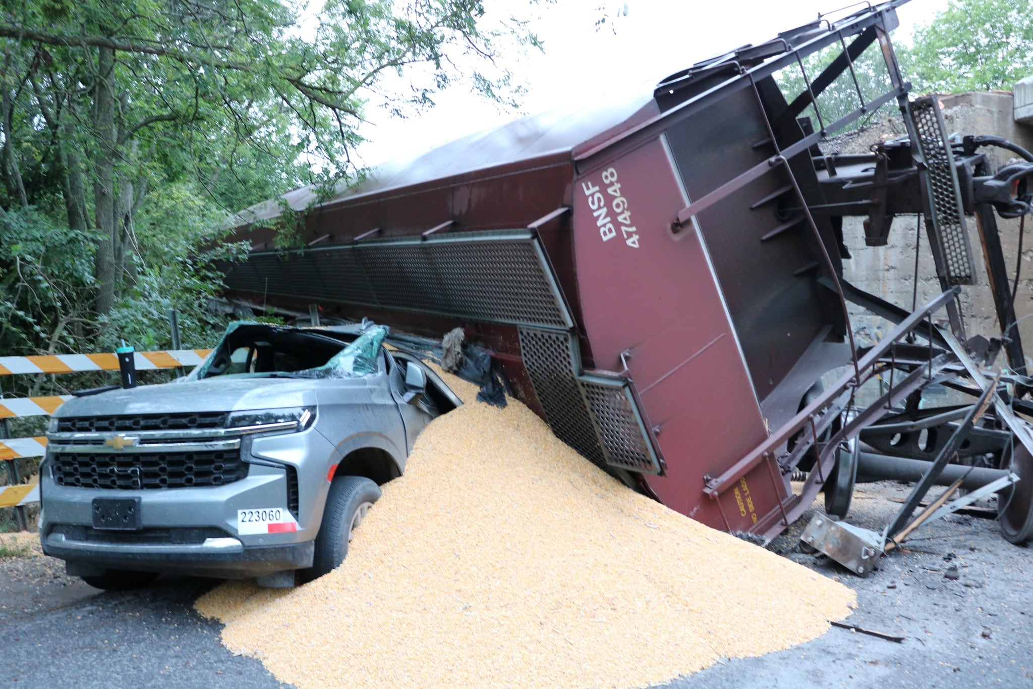 A BNSF train derailed in Red Oak, landing on a parked Railcrew Xpress vehicle Thursday morning. The driver was treated for minor injuries.