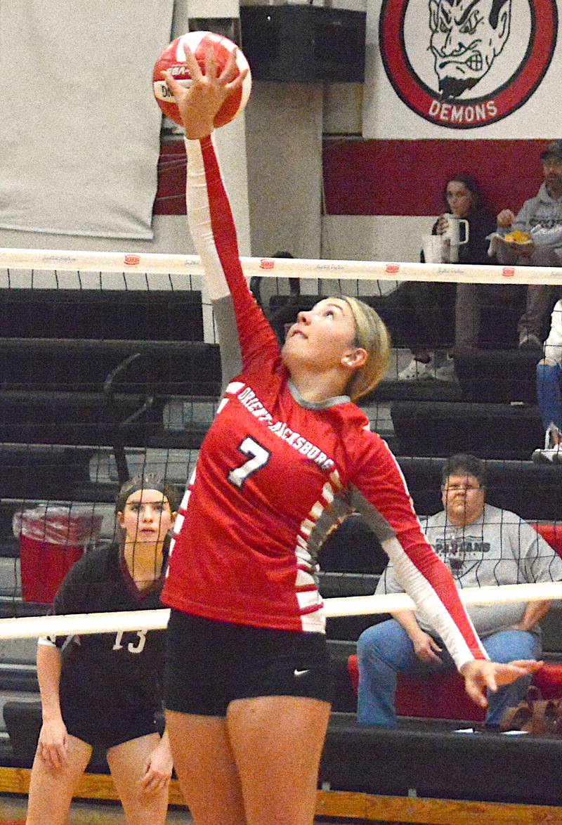 Emma Boswell hits the ball over the net during a playoff volleyball match against Exira-Elk Horn-Kimballton.