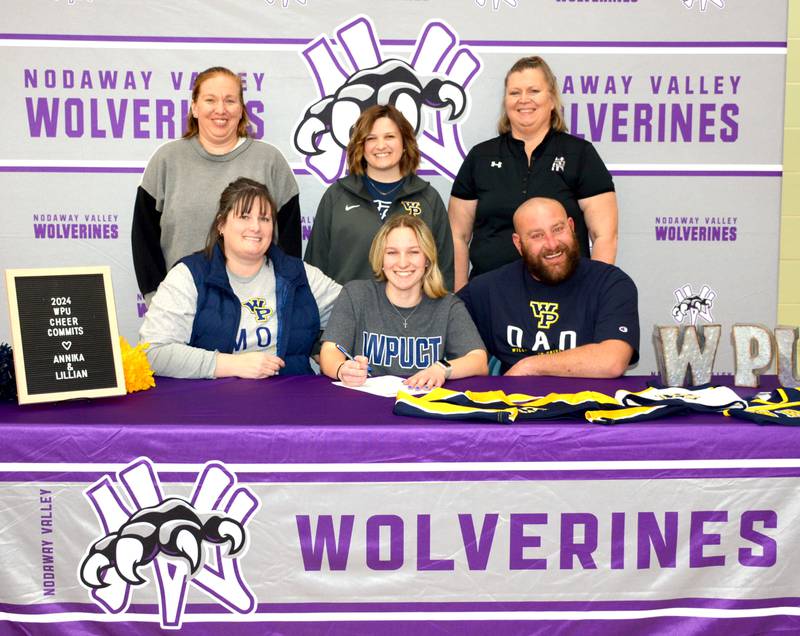 Pictured with her parents, Tina and Chance, and high school cheer coaches Nicole Moser and Crystal Ruth, Nodaway Valley senior Annika Phillippi signs to cheer at William Penn University.