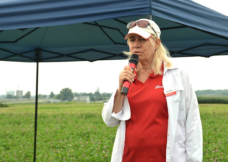 Iowa State University professor Dr. Kathleen Delate talks at a stop on a farm tour during the Neely-Kinyon Research Farm annual field day south of Greenfield.