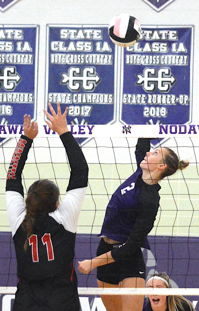 Nodaway Valley's Bailey Carstens rises up for a kill attempt in a match earlier this season against Mount Ayr. Carstens led the Wolverines during the regular season in blocks.