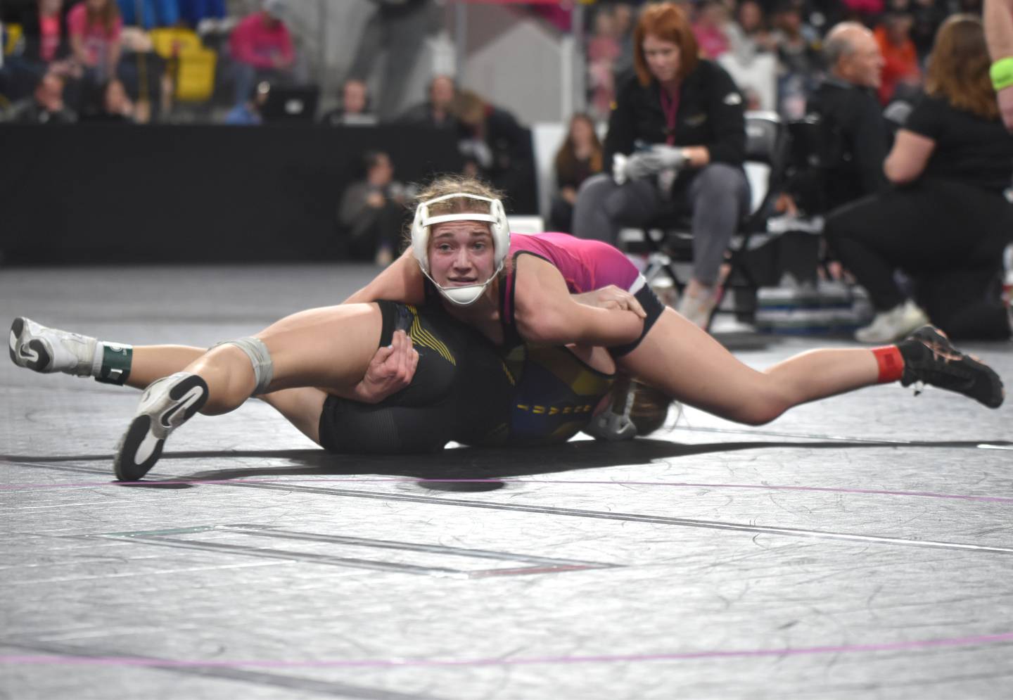 Zoey Vandevender (125) gets back points on Ava Streeter of Duram in her second match at the Iowa High School Girls Wrestling State Tournament Thursday in Coralville. Vandevender won the bout in a second-period pin.