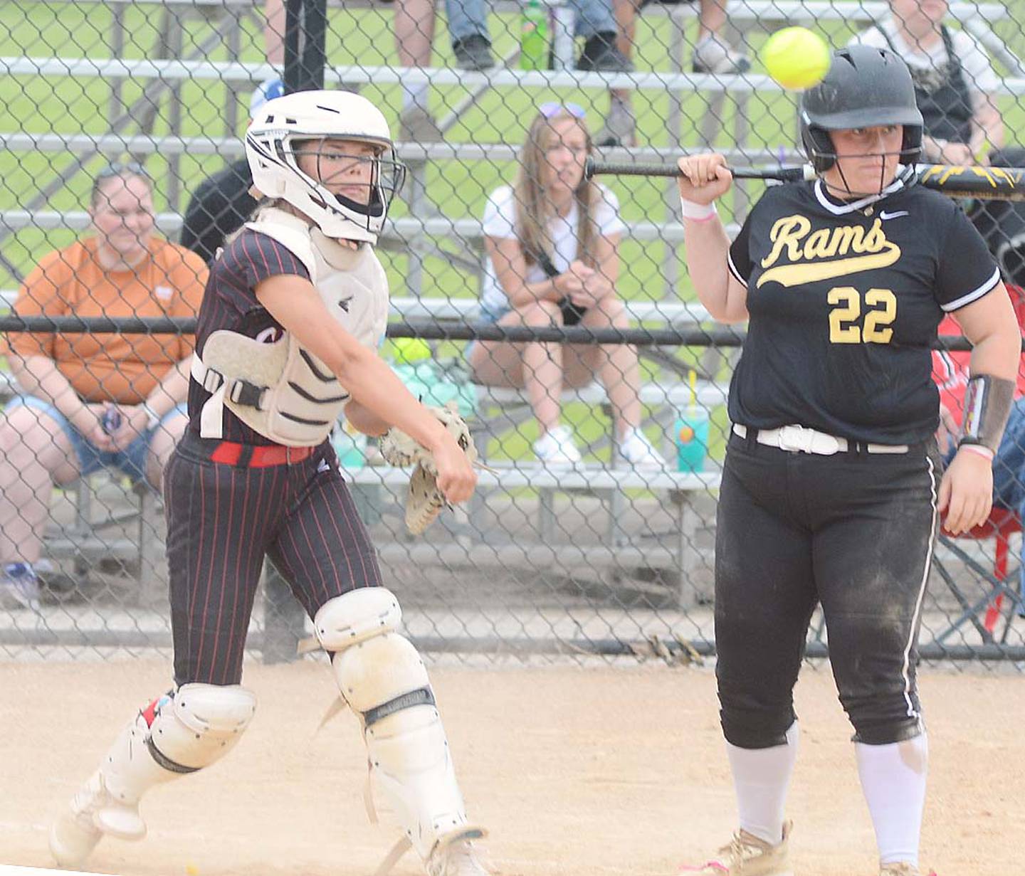 Creston catcher Ava Adamson fires a pickoff throw to first base during Thursday's 11-1 win over Glenwood. Adamson had three hits, including a home run.