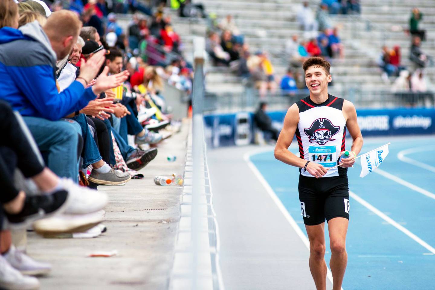 Reynolds takes a victory lap after winning the 400m dash at the 2023 Drake Relays.