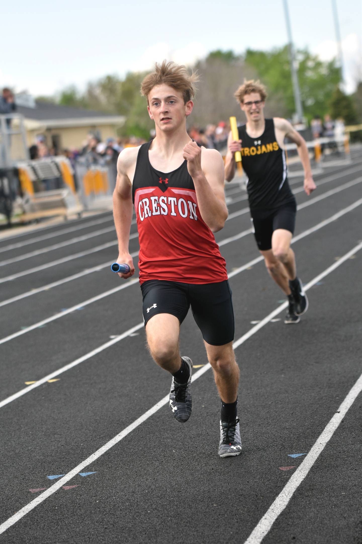 Creston freshman Davin Wallace comes down the final stretch in the boys 4x800m relay ahead of the Atlantic anchor. The 4x800 is one of three relays in which the boys qualified for state.