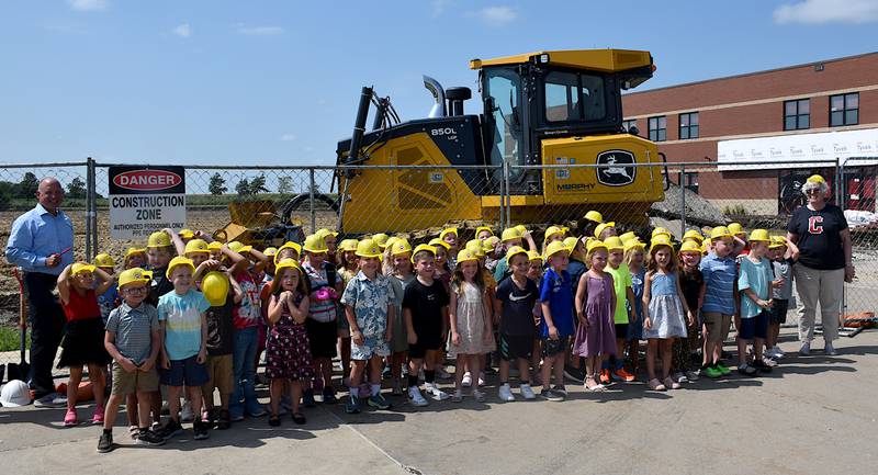 Creston Early Childhood Center students pose Wednesday during groundbreaking ceremonies of the new center under construction at the elementary and middle school campus.