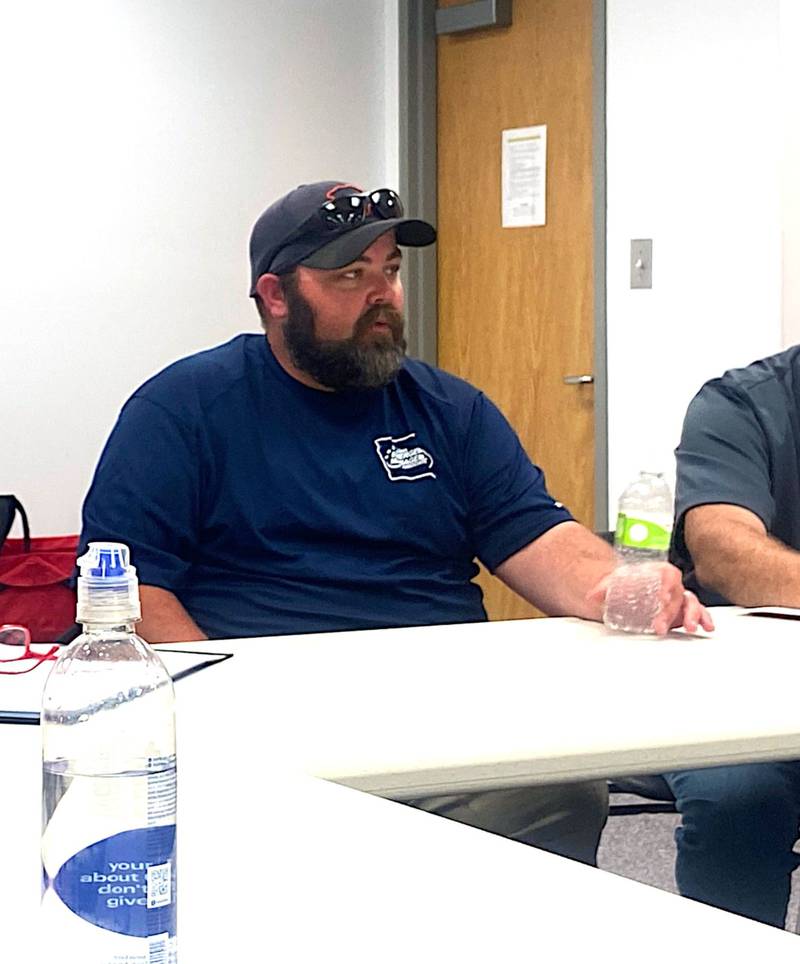 Adair and Guthrie County EMA coordinator Jeremy Cooper in a meeting weeks after the May 21 tornado.