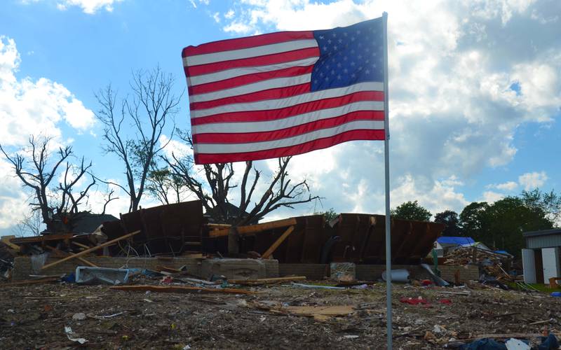 A greenfield tradition lives on despite the damage. The town's Scouts of America put out Memorial Day flags in front of Dorsey and Gymer's home.
