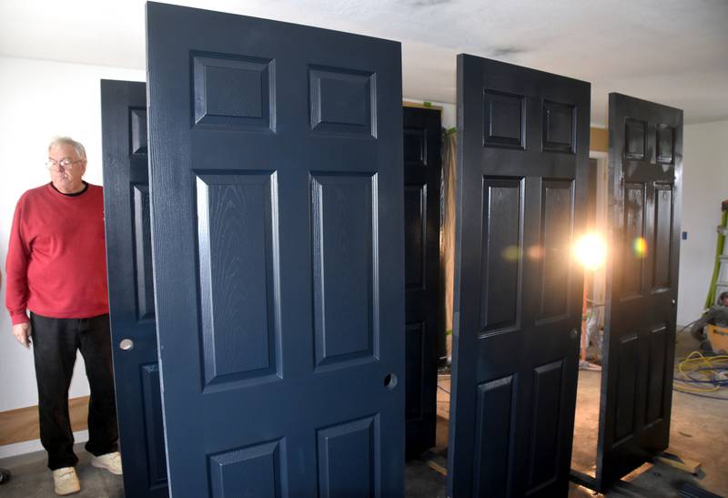 Charles Westman looks at the interior doors of a house built by Habitat for Humanity of Union County under construction. The organization changes its name July 1 but continues the same purpose.