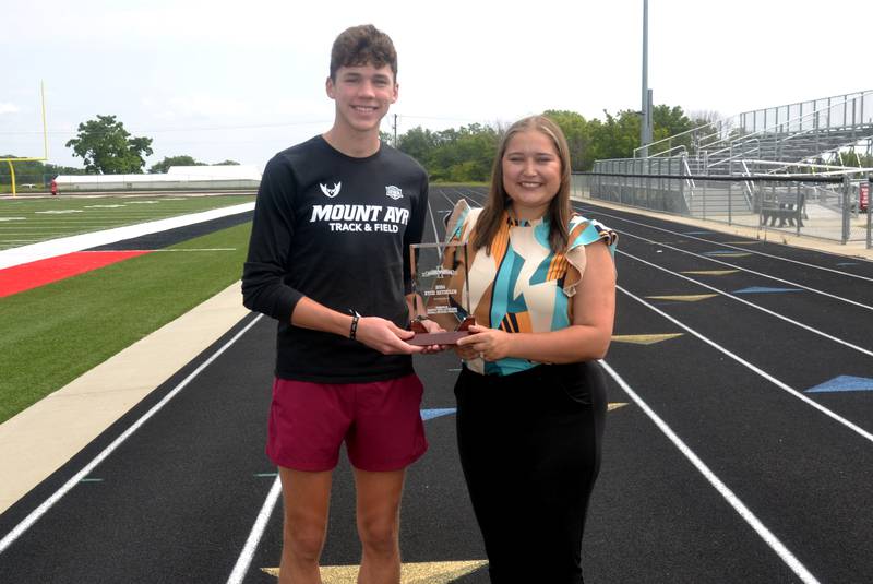 CNA Senior Editor Cheyenne Roche presents Mount Ayr's Ryce Reynolds with the 2024 South Central Iowa Male Outstanding Athlete Award.