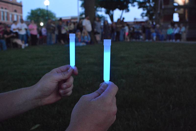 Glow sticks lit the early night sky on the Adair County Courthouse lawn at the conclusion of the Greenfield Strong Gathering held Tuesday, May 28.