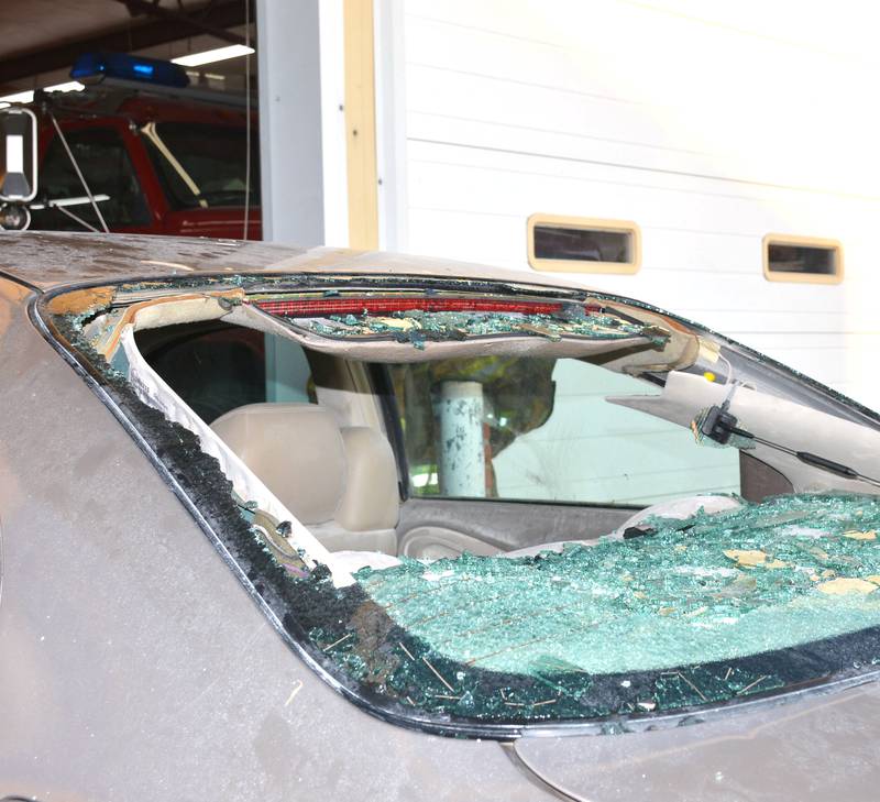 Hail damages car windows during a severe thunderstorm that struck Orient in 2022.