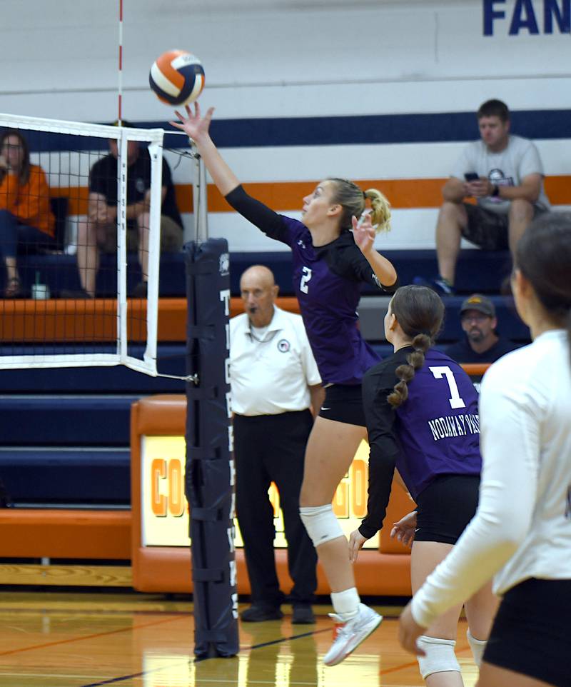 Nodaway Valley senior Bailey Carstens (2) hits the ball back over the net against an opponent in the Colfax-Mingo tournament Saturday. The Wolverines went 0-4 on the day but picked up valuable early-season experience against teams from other parts of the state.