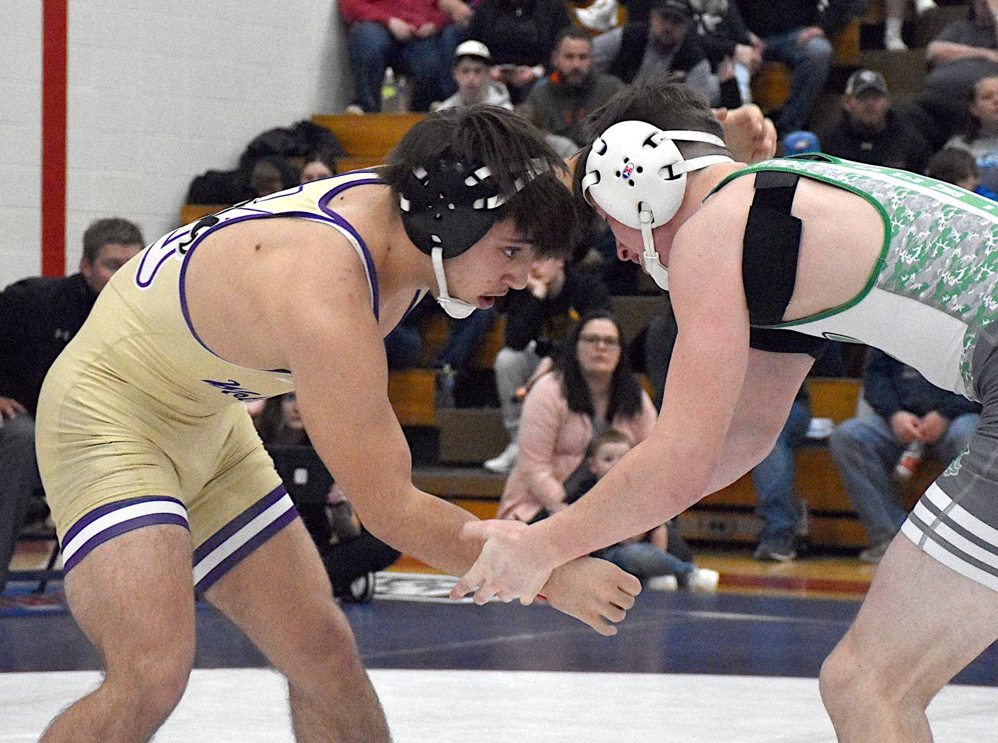 Carmine Shaw hand fights with a SEW/MD opponent at the district tournament held Saturday, Feb. 10 at Interstate 35.