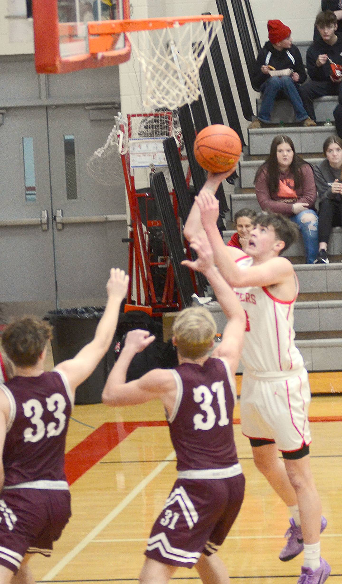 Creston's Jake Hoyt finishes a Panther fast break with a short-range shot during Tuesday's 64-31 victory. Hoyt had a team-high 21 points and eight rebounds.